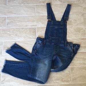 Distressed denim overalls